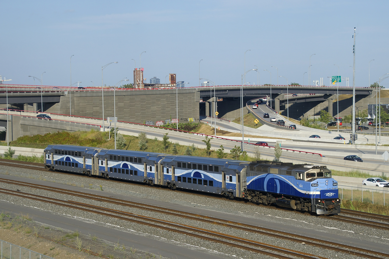 EXO 1211 has AMT 1343 and 3 multilevel cars as it passes the Turcot interchange. With new schedules posted by EXO at the end of August, a third departure to and from Mascouche was added and Mascouche trainsets went from 4 or 5 cars to 3.