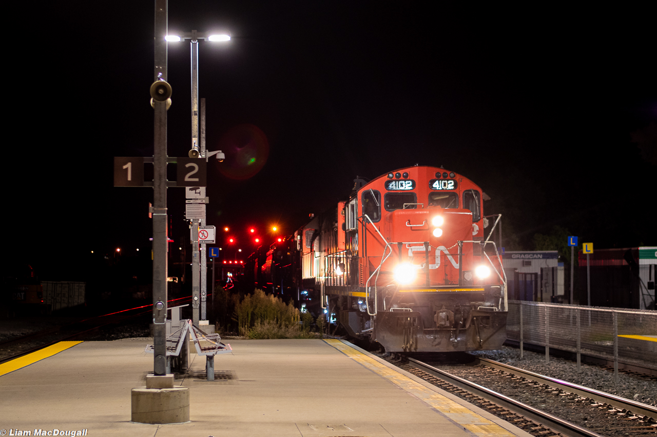 CN 4102 leads a triplet of GP38s on L549 as they head northwest through Weston GO in the darkest hours of the night with Mac Yard interchange traffic from the CP at Lambton. As much as I have a dislike for the look of many new GO Stations, the LED platform lights make night shooting much more bearable.
