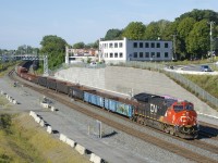 After setting off cars in Taschereau Yard, CN 322 is heading to Southwark Yard with CN 3180, 70 cars and CN 3916 on the tail end.