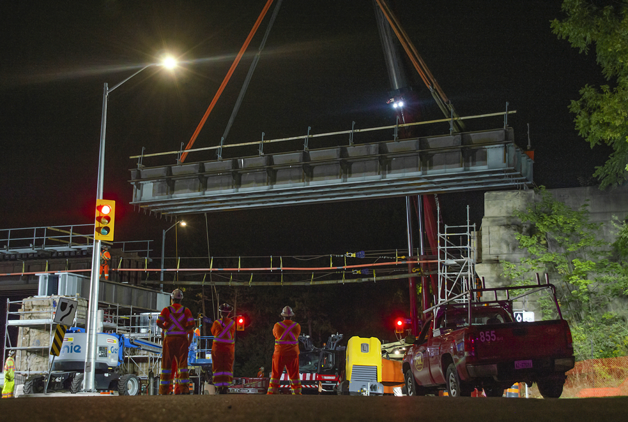 The replacement of the Metrolinx Guelph Subdivision bridge over the Speed River in Guelph – affectionately called Allan’s Bridge by locals for the old mill nearby – is well underway as the first replacement span is lowered with care and precision by the diligent crews of Mammoet, time 4:17am. After careful alignments and minor adjustments were made the span touched down at 4:56am.Over the coming weekends all seven main spans – each weighing in at 200,000 lbs – and transverse members installed in 1948 by the Canadian Bridge Company of Walkerville, Ontario, will be replaced to extend the life of the bridge, allowing for increased speeds and future double tracking. The new bridge will rest upon the original 1856 limestone abutments and piers constructed by the Grand Trunk Railway – still in solid shape at 160 years of service.A shot of the spans being replaced by the Canadian National Railway in 1948 can be found here in the Guelph Museums' Collection.