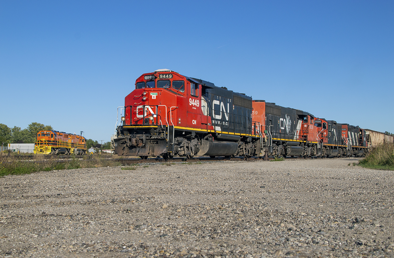 After spending some time working the Huron Park spur, L568 returned to Kitchener yard to lift the set of GP9s for the run to Kelly's.  Here the full set is seen working Stratford Yard, pulling a cut of potash cars out of the old Buffalo Yard tracks while power for the GEXR Goderich operation: GEXR 2073, RLHH 2117, rests on the service track.