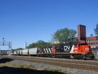 The Pointe St-Charles Switcher is pulling 21 grain loads from track 29 with GTW 6226 & CN 4141 for power . The grain cars are destined for track PC-27 (Five Roses Flour). Eighteen of the cars are MGLX cars.