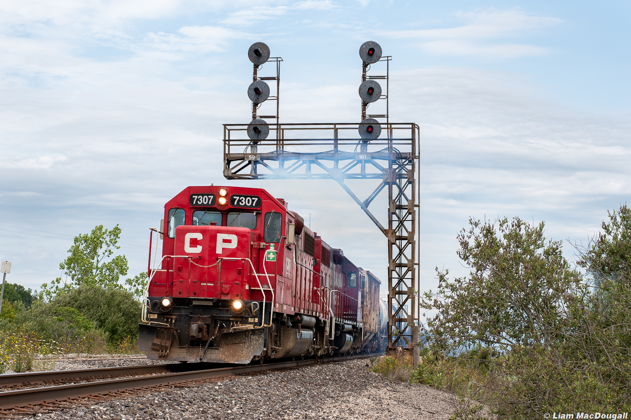 CP 7307 gives our lungs a run for their money as the engineer throttles up through CN Yager after interchanging traffic at Southern Yard in Welland, ON.