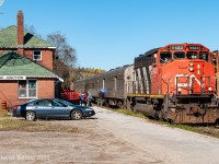 They weren't the best of times but they were certainly better than how they are now found along the former Algoma Central in 2021. The southbound passenger, labelled as the "Tour of the Line" train has arrived at Hawk Jct and is taking on a couple passengers while a couple detrain. It's a busy few moments as totes and coolers are unloaded from the baggage car. On the paved platform a number of baggage carts take up real estate, being as inviting and patient as possible for any guests. One may end up being used to rest any waiting luggage, fishing or hunting gear. 