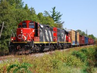 CN 580 didn't run to CGC on Wednesday or Friday, so CN opted to run an extra 580 on Saturday to serve their Hagersville Sub. customers.  The boxcar was lifted from Rembos in Caledonia.  The train is shown at Fifth Line south west of Caledonia, on their way to CGC just outside of Hagersville.  We learned that 580 no longer goes in to Hagersville to turnaround; I guess they split the power and get the power to the opposite end of the train while switching at CGC.  With the GMD-1s gone from the roster, zebra-stripped GP9RMs are the next best thing.