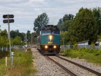 VIA #60 has <i>slowed down</i> to 80 mph as it flies across the South Nation River and bounces over the Dollard Street crossing, about to slam past the station and through the rest of Casselman.<br><br>
Wait, VIA #60? Due to a CN derailment in Prescott on September 2, VIA was detouring all Toronto-Montreal frequencies through Ottawa. VIA #60 normally runs as a J-train to Brockville with #50, but today it remained attached through to Ottawa. From Ottawa, it was cleared to race to Dorval, in a futile effort to make up lost time. This train was the final detour - its counterpart, VIA #61, sat in Coteau for a while before heading straight down the Kingston Subdivision.