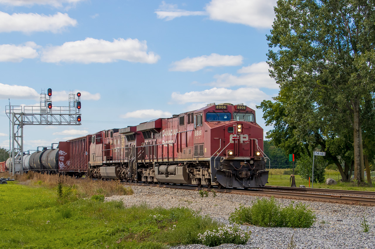 CP 8906 and 9710 (plus DPU 8912) lead #112 through the new plant in Finch, Ontario. Through 2020, the Winchester Subdivision was converted from a directional-double-track, ABS-signalled territory to a CTC-signalled single track with sidings. There used to be a pair of single-searchlight intermediate signals east of the Main Street crossing in Finch. I had hoped to catch a train there before the end of ABS, but that didn't work out. However, the crossing in Finch is still double-tracked, as the former north main here serves as one of the new CTC sidings. The new LED signals are no searchlights, but at least they put them on a cool gantry. Plus a backtrack off the siding retained one of the hand-throw switch targets.

Finch was at one time a junction, where the New York Central line to Ottawa crossed the CP main. The NYC gave up the line in 1957, when their bridge in Cornwall became a casualty of the St. Lawrence Seaway opening. However, before this happened, rail operations in Finch were captured in a  National Film Board short.