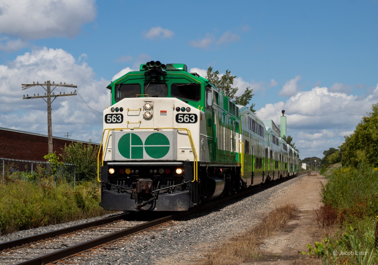 GO 563 leads a Southbound Barrie Line train through the Castlefeild Avenue level crossing on the Newmarket Subdivision.