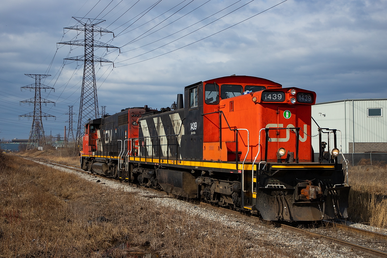 After dropping cars at Parkdale Warehousing, the crew of the 0700 Yard Job heads back towards their train, waiting for them near Brampton Street/Strathearne Ave. Next up would be Parkland Fuels, but with clouds rolling in, it was just a quick couple shots for me on this day.