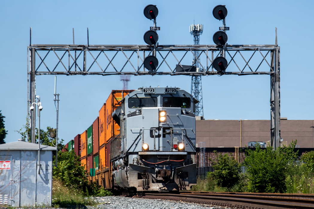 CP 7023 leads a late CP 142 under the searchlight signals at West Toronto. After many delays and the engine randomly applying the brakes during the trip (13 times between Chicago and Lambton I believe), RTC gave 142 lights to Toronto yard where a diesel doc would look at the unit. The future of these searchlights is in jeopardy as Metrolinx has offered to pay for signal upgrades to the West Toronto switches and SearchLITEs (LED searchlights) have already appeared at the west end of the control point.