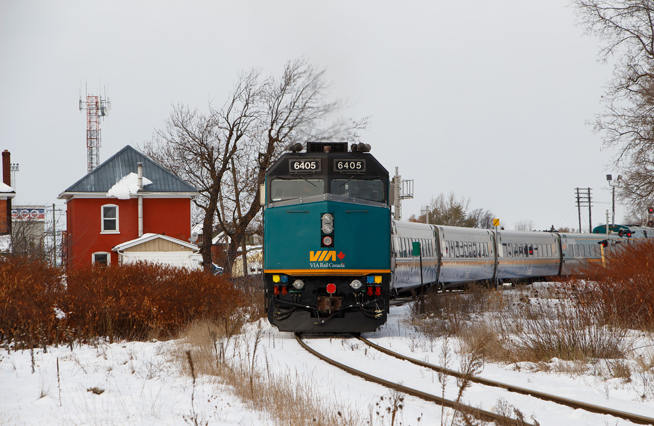 Smiths Falls had some early snow on the ground in mid-November of 2018, as VIA 6405 carries the paddle on #52. The train has just cleared Chambers Street and is occupying William Street East. Up front, VIA 917 is facing a Slow to Stop signal, allowing it to enter the CP Winchester Sub and meet VIA #53. In between were LRC cars 3468, 3335, 3313, 3340, and 3365. The train's bidirectional consist would allow it to return to Toronto as #640 later that afternoon.