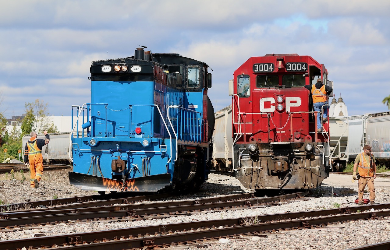 A photo opportunity that will soon be no more. As luck had it OBRY showed up today before CP T14 departed for Toronto. Sadly this scene will not happen anymore after this year with the end of OBRY operations on the horizon. It is nice to catch a friendly interaction between crews before continuing their day. Once OBRY finishes their drop, CP will head over and lift it along with the rest of the days train. Out of view to the right is a decent cut of cars for OBRY to forward to Orangeville. The cycle continues, for now.