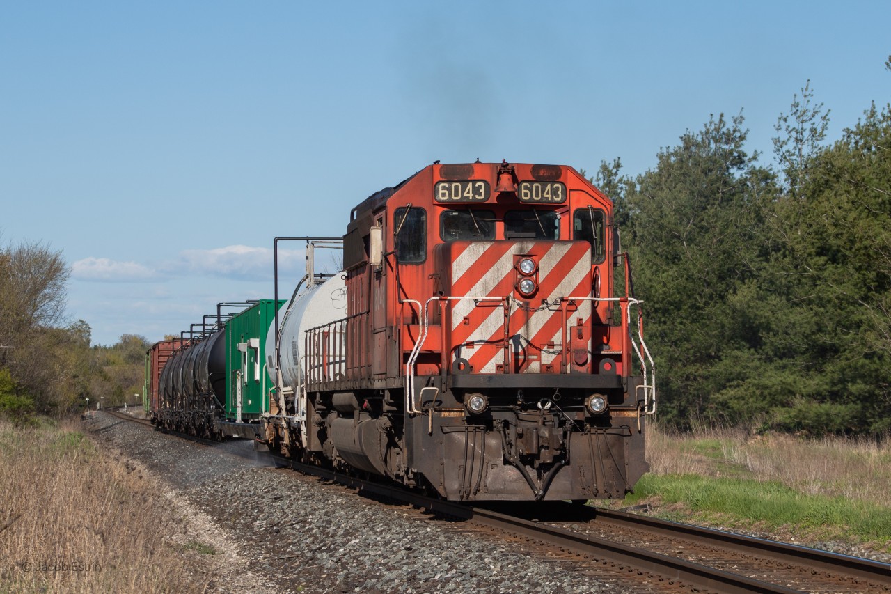 Shortly after meeting 118 at Cherrywood the spray train lead by CP 6043 continues West passing Reesor Road in Toronto's East end.