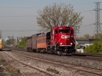 CP 2241 leads the Track evaluation train through Dixie at trackspeed with a Milwaukee Road passenger coach.