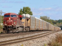 A zoom lens seems to do a bit of justice to the grade westbound trains must battle climbing the Niagara Escarpment between Milton and Guelph Junction. I have many fond memories of spending hours in this area at all times of the day listening to the constant battle of EMD's, GE's and MLW's fighting the grade here, some losing that battle too. Much has changed at the junction over the years but the battle has not. Here a 10,00 foot 651 with mixed traffic up front fights its own battle as it heads westward with a CP and UP ES44 in charge.