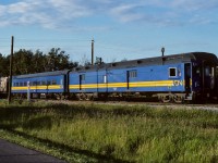 At the very northeast corner of Redwater, the tail end cars of the Muskeg Mixed are leaving town and heading down to the river. That is CN coach 5095 and baggage 7857. After conversion, I came to term it a bagboose. :-) You can see mile post 30 up on the pole. It is 20:00 and in less than 15 minutes I will be at Egremont for a photo of the head end. Please see neighbouring thumbnail.