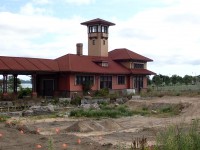 Image caption: A bit of a time machine shot. sdforty's shot from 1978 prompted this updated shot. The station was boarded up in the late 80's. When CN abandoned the Newmarket sub north of Bradford in 1996, the land and track to Bradford was purchased by the City of Barrie. The buildings were fully restored in 2011, but ended up in a lawsuit due to a development deal gone sour. Subsequent to that a full archeological assessment is being done to address first nations concerns. The piles of soil and flags are part of that process. Excavation on the site has also revealed the stone foundation of the original Ontario, Simcoe and Huron station. The Master Mechanic's building was restored as part of the Southshore Community Centre in 1994. Here's the link to the photo from 1978. http://www.railpictures.ca/?attachment_id=46116