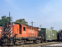 CP Rail RS18 8765 is seen working Woodstock yard.  With extra flags up, it may be building its train to head down the St. Thomas subdivision to the Railway City, or onto the Port Burwell Sub at Ingersoll.  Built in 1958, 8765 would be chop nosed and renumbered to 1867 in July 1989, sold to the New Brunswick East Coast Railway in April 1998, and finally to National Railway Equipment in October 2009 for scrapping after the NBEC was purchased by CN.<br><br><i>Ian Platt Photo, Jacob Patterson Collection Slide.</i>