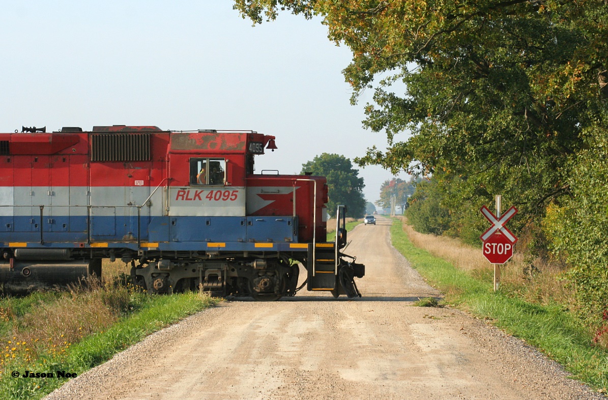 Just as the fog lifts to reveal a sunny morning, RLK 4095 crosses Road 170 south of Seaforth on the Goderich Subdivision as it leads Goderich-Exeter Railway 581 to Hensall, located on the Exeter Spur.