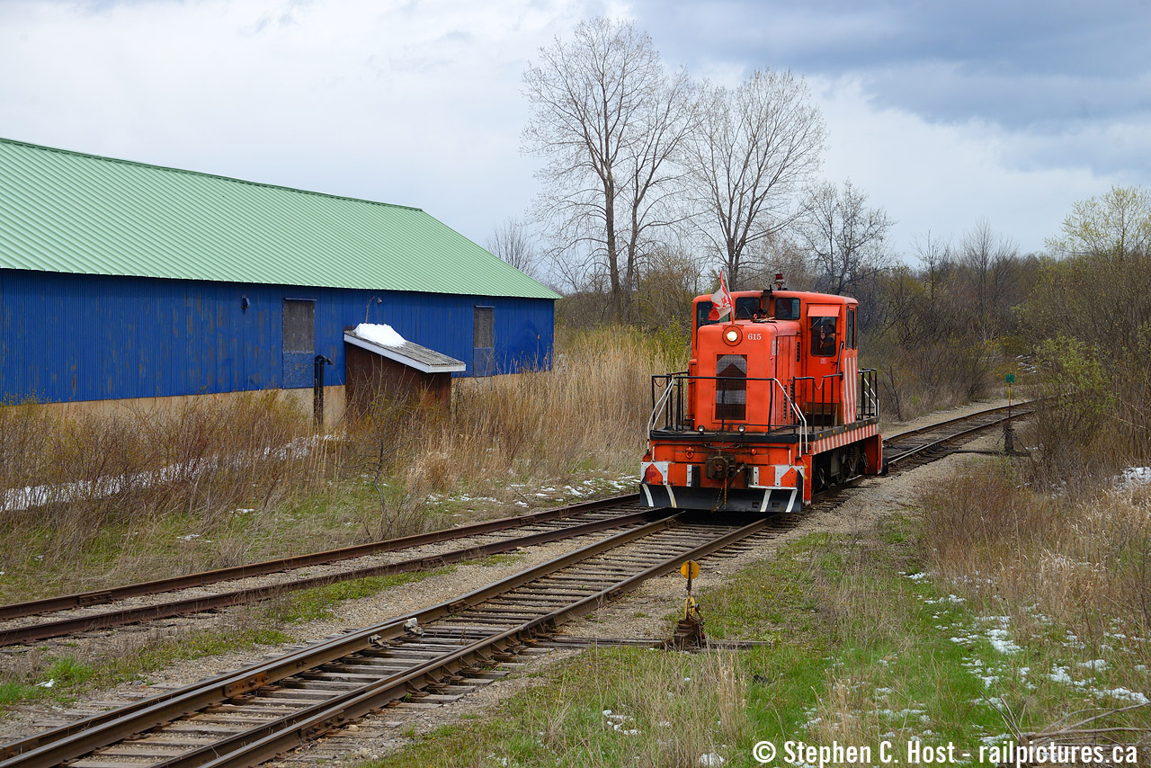 Returning after working Southern Yard, former Stelco GE 80T #7 now numbered 615 is about to cross Rusholme Road, as they are done for the day.