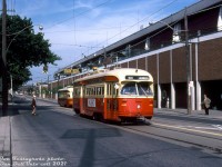 TTC PCC 4482 has just passed another PCC as it heads west on Queen Street East past the intersection for Kingston Road, operating on a Rt.501 Queen run enroute to Humber Loop.<br><br>In the background is the famed Greenwood Raceway, Toronto's east end horse racing track that opened in 1874 as the "Woodbine Race Course" that stretched along the <a href=http://jpeg2000.eloquent-systems.com/toronto.html?image=ser12/s0012_fl1968_it0031.jp2><b>south side of Queen Street</b></a> from Greenwood Avenue to Woodbine Avenue. A new track opened in suburban Etobicoke in 1956 as the "New Woodbine Racetrack", until the "new" was dropped in 1963, and the old Woodbine site here renamed "Greenwood Raceway" after extensive renovations. It was eventually closed in 1993, demolished, and the site redeveloped into residential housing and commercial developments.<br><br><i>Joe Testagrose photo, Dan Dell'Unto collection slide.</i>