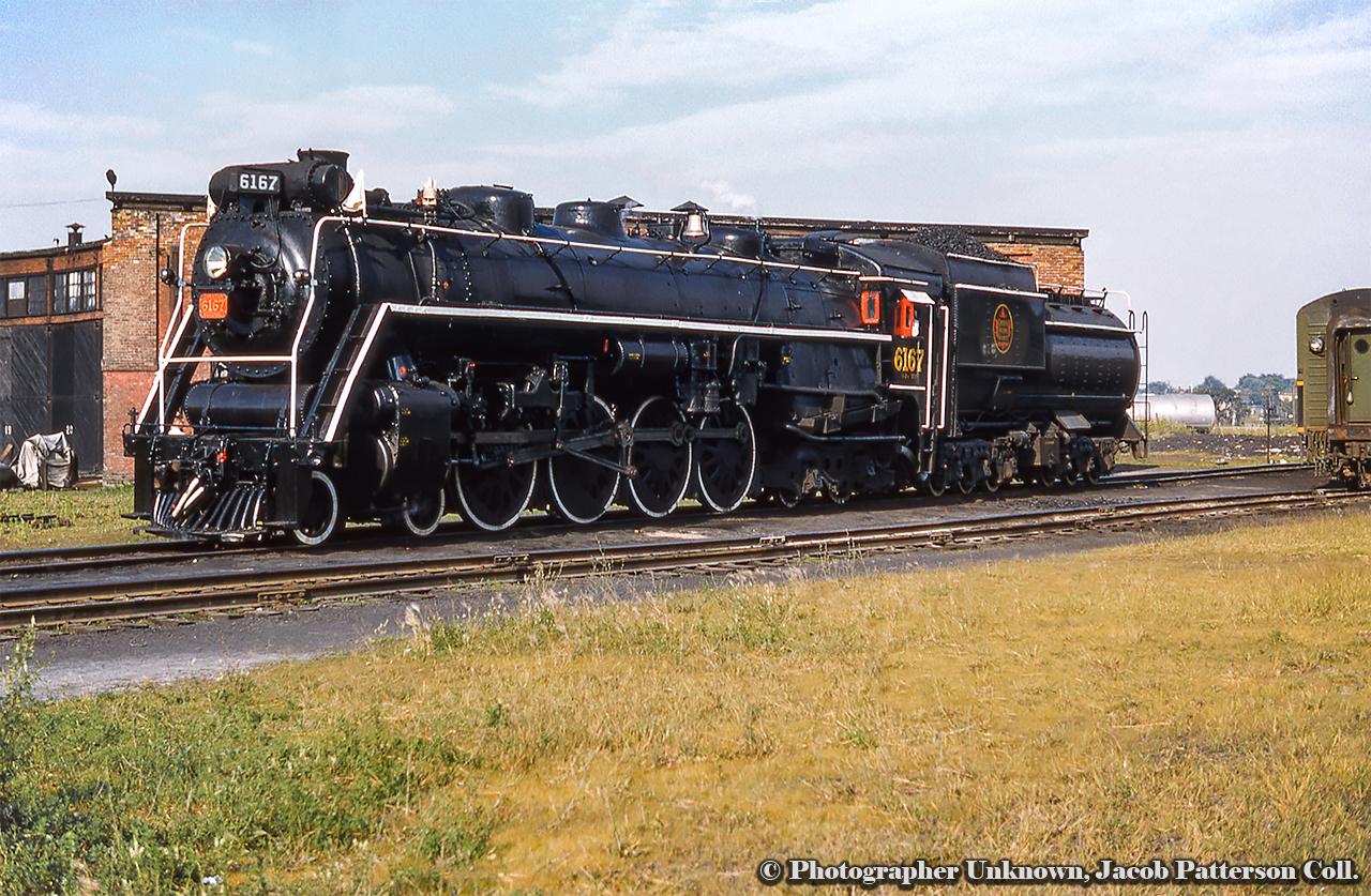 Gleaming with fresh paint, CNR 6167 is seen early in her excursion career at the Niagara Falls Roundhouse on July 10, 1960 during an Upper Canada Railway Society excursion running Toronto - Niagara Falls via Hamilton - Caledonia - Welland Junction - Pot Robinson - Stamford.*  She is seen having been turned and ready to depart back to Toronto.  On display t Guelph, and relocated to Priory Park just last year, 6167 is now in the collection of Guelph Museusm and is currently receiving some paint touch ups from the dedicated 6167 restoration team.*Routing per UCRS June 1983 newsletter.  Stay tuned for a slide of 6167 in 1959 during her first retirement.  Original Photographer Unknown, Jacob Patterson Collection Slide.