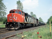 CN SD50AF 5500 and a matching zebra-stripped SD40-2W grind up hill through Copetown, ON. It's hard to believe this was taken 17 years ago.  CN 5500 was sold to the Dakota, Missouri Valley & Western and continues in service for them with many other CN cast-offs, including several SD50F, SD50AF and SD60F.