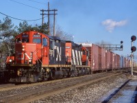 For those that got a chance to spend a morning at Burlington West back in the day remember it for being a great place for rail fans to hang out, usually without any hassle from CN police as well. It's a shame that it is now out of bounds. It is not the same with the removal of the station anyway. While the east end of the Oakville sub. had few through freights it was always nice catching the Oakville-Aldershot transfer jobs like 550. The Geeps always look good in clean paint hauling a long cut of parts boxes and auto racks. Today the third track has altered the signal arangement and weeds cut off a lot of the angles here not that I venture in much anymore for obvious reasons. 