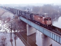 <br>
<br>
   One of those grimy winter days, felt like a gray cloud descending on the landscape.....
<br>
<br>
   Then CP Rail Extra 4718 West  lifts spirits rolling into view with two B & O geeps: 4807 and 48xx. 
<br>
<br>
   At CP Rail Coakley, February 18, 1984 Kodachrome by S.Danko
<br>
<br>


