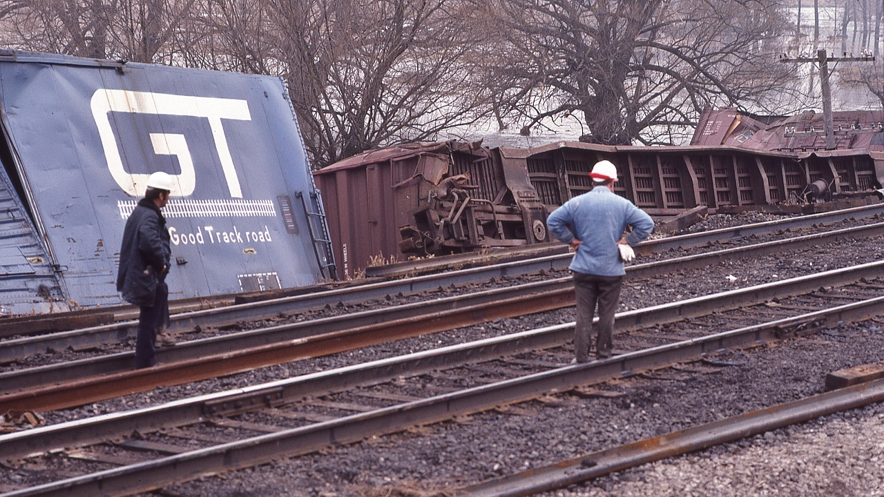 a Track Foremans' lament:   “ Well Sam, where shall we start ? …...”


   Nothwithstanding the GT slogan....at CN Beachville, February 18, 1984 Kodachrome by S.Danko 


   Noteworthy: 


February 14, 1984: A 25 car CN train derailed four miles west of Woodstock ( Beachville) causing $1 million damage. Half mile track torn up, propane tankers included in consist. Heavy rains blamed for weakening the track bed. Reportedly every spring new remnants of the derailment can be seen along the Beachville Thames River Trail – pushed up by the winter frost. 


       first train through  


   sdfourty
