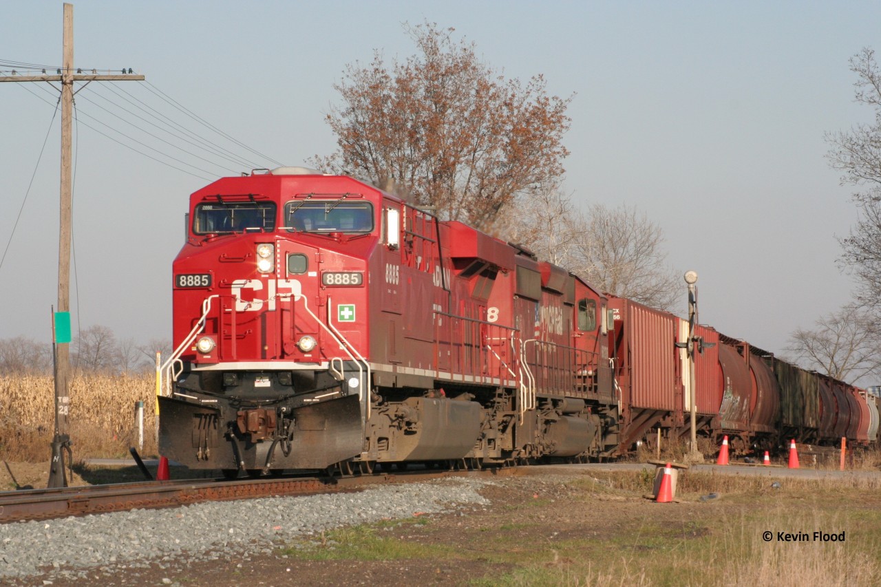 A CP westbound is pictured at the east siding switch Wolverton (Ayr, ON) on November 5, 2008. Power was relatively-new CP 8885 followed by SD40-2 #6028. By the late 2000-2010 decade, the CP GEVOs were beginning to takeover (older GE models -9600, 9700 and 9800 series - dominated); however, there were still a number of SD40-2s still in active service, often unfortunately, in trailing positions. Also note, this was the beginning of the construction of Wolverton Yard and the new signals.