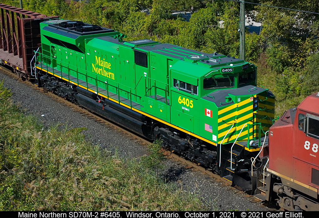 "Green with Envy", is how I've felt with the new Maine Northern and New Brunswick Southern power going south of Lake Erie on train 142, bypassing Windsor.  Fortunately today, train #140 gave us a gift with Maine Northern #6405 in tow.  Seen here from the Ouellette Ave. overpass in Windsor as train #140 completed it's lift/setoff in the yard.  Shortly after train #140 left Windsor around 14:20hrs.