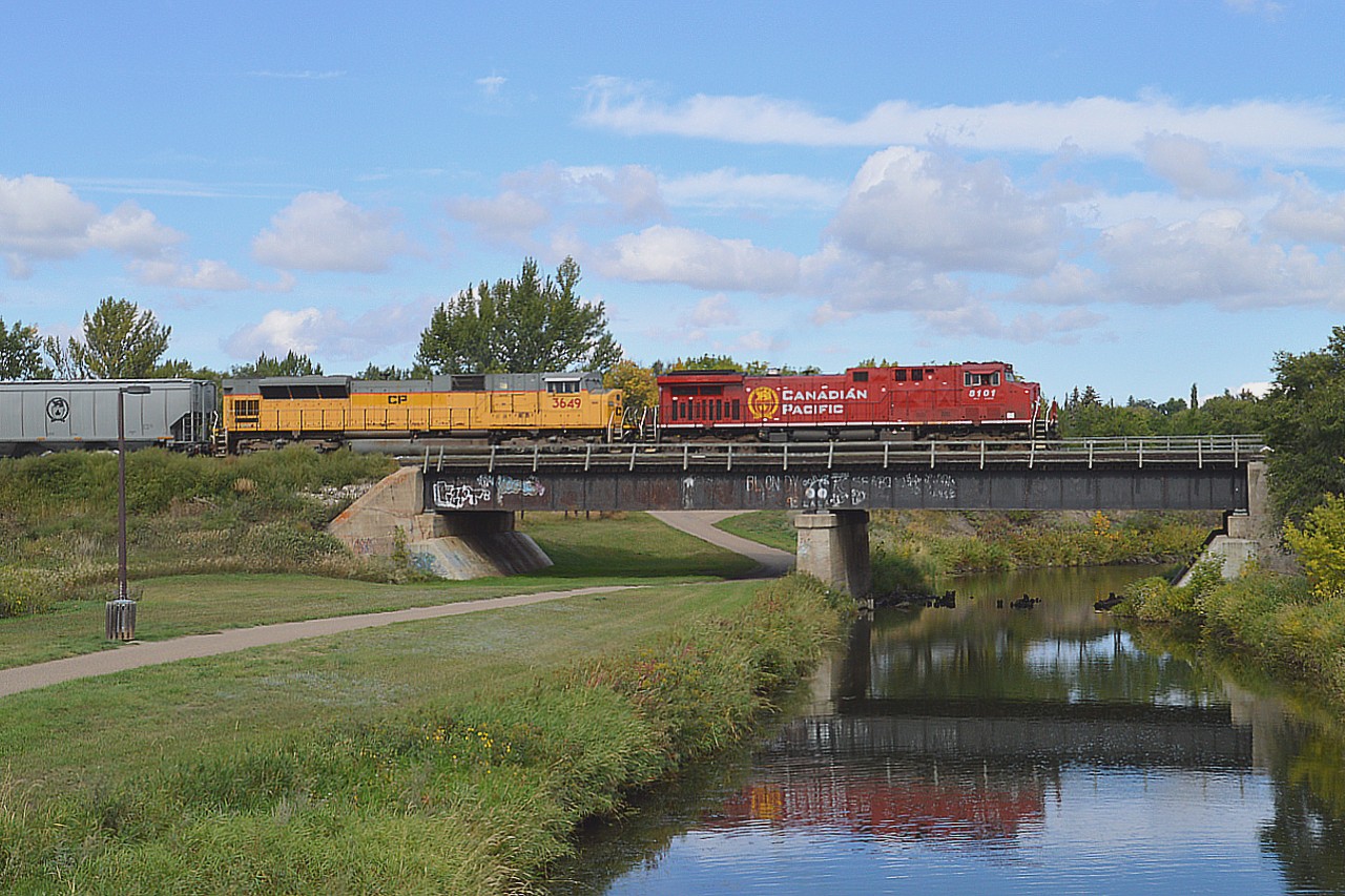 Finally!!!   I did not think I was ever going to see one of those elusive UP locomotives, a block of 40 which the CP purchased earlier in the year..........and here is X-UP 3639 sporting a temporary "CP" on the flanks. It is trailing a recent CP rebuild, 8101, photographed as it rolled over the South Saskatchewan River. Train is heading east toward Moose Jaw. Forgot to write down the train number as this thing had me scurrying to get a few decent shots before it headed out of town.