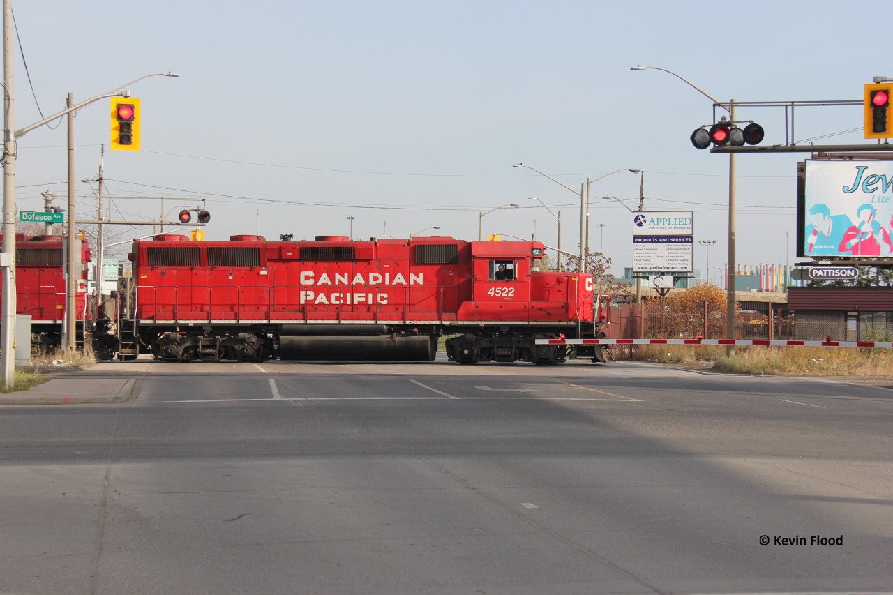 One of the CP Hamilton Jobs is pictured crossing Kenilworth Ave. in Hamilton’s north end industrial area on a sunny November Friday with CP 4522 leading two other GP38-2s.