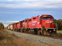 CP GP38-2 #3033 leads a stellar lashup consisting of fellow GP38-2s #3063, #3040, and ES44AC #8834 on 254 towards Welland Yard down the Hamilton Sub at River Road on a cool autumn evening.