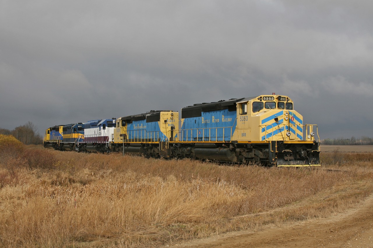 After bringing a unit train of Barley across the former CN Alliance Sub, 5 Battle River Railway units wait patiently for CN L 51851 18 to arrive and take charge of the train.

The power was: BRR 5353, BRR 5251, BRR 3434, HLCX 4211 and BRR 5951.