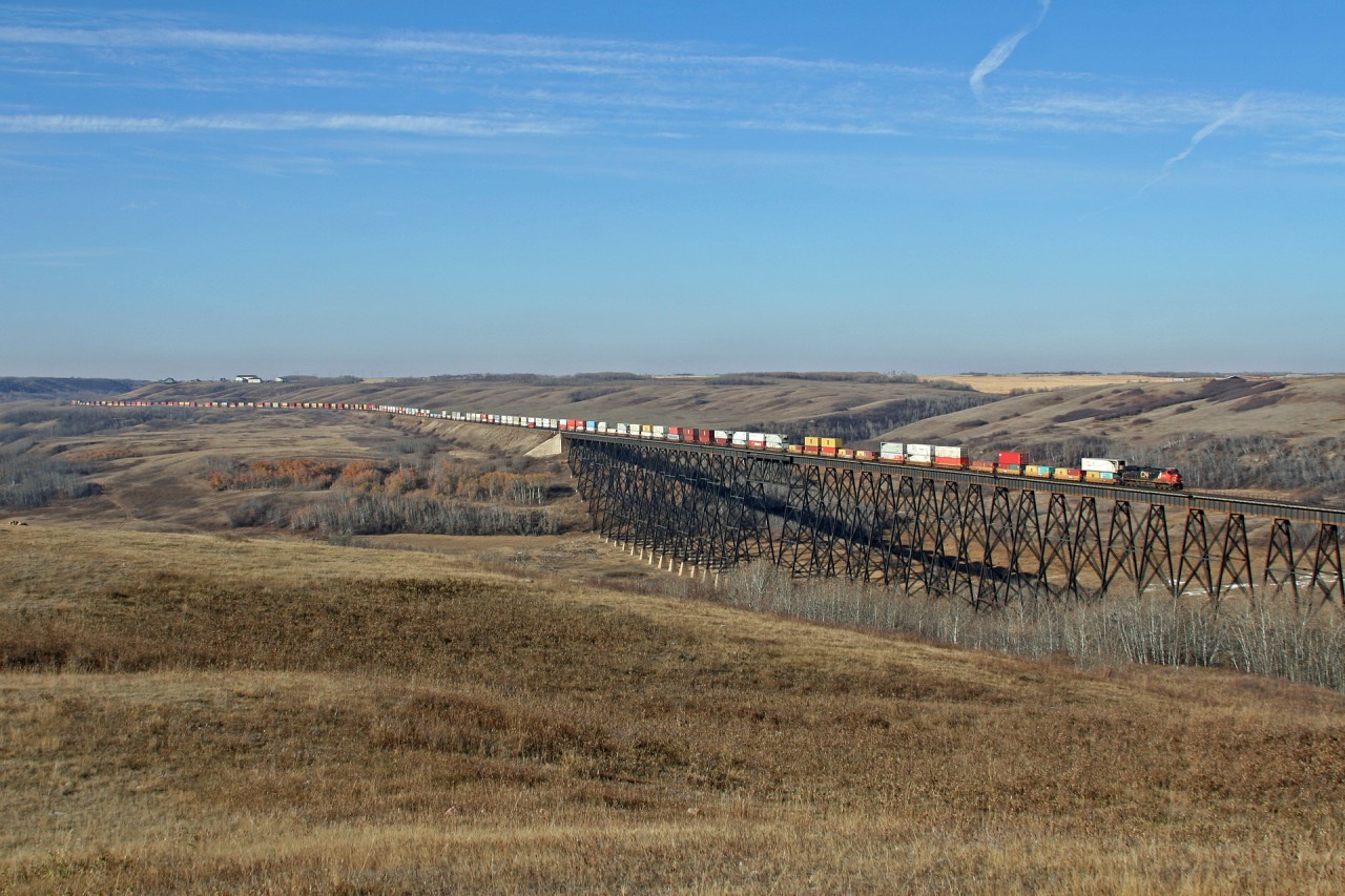 A winter chill is in the air, as Vancouver to Toronto Q 10251 11 rolls through the Battle River valley and over the impressive trestle.