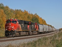 Edmonton to Prince Rupert grain drag G 86741 27 is 25 miles into its journey as they work upgrade through Spruce Grove.  This 205 car train has CN 3113 and 3173 on the head end, and tucked away midtrain is CN 3023 - the EJ&E heritage unit.
