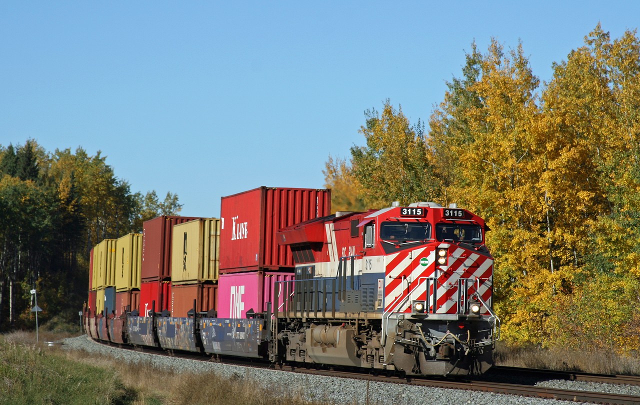 Q 11651 20 leans into the curve at Mile 25 Edson Sub, as they fly downgrade towards Spruce Grove