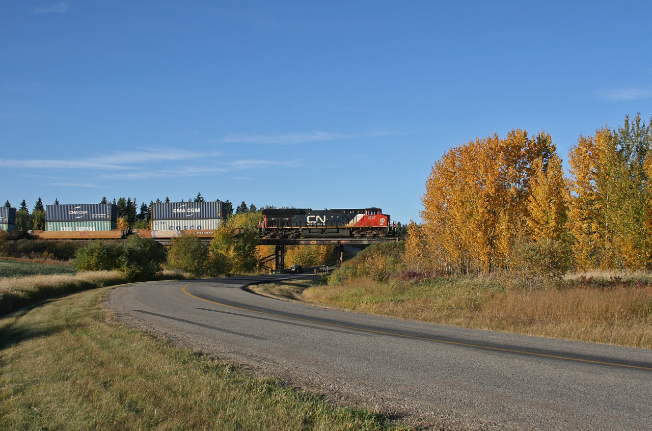Prince Rupert to Chicago train Q 19851 21 rolls through the countryside, on the outskirts of Edmonton