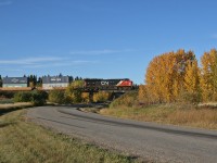 Prince Rupert to Chicago train Q 19851 21 rolls through the countryside, on the outskirts of Edmonton