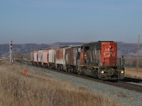 After an overnight run out to Torlea (Viking, Alberta), the as required Wainwright roadswitcher 513 rolls through Fabyan with 7 cars.  CN 5276, fitted with portable ditchlights for the occasion, leads a quite existence in Wainwright, only being used on these extras which run a few times a month.  