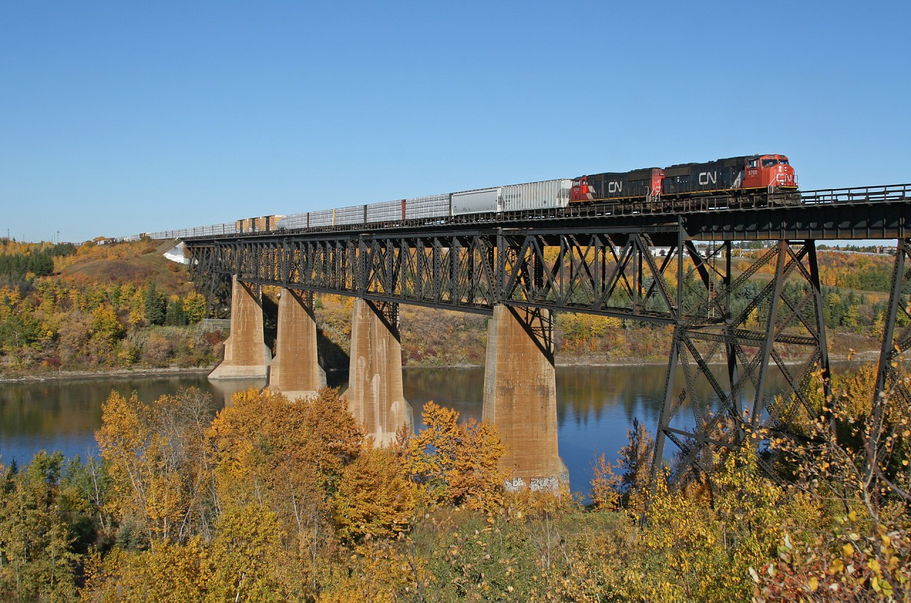 The fall colours have just about peaked in the Edmonton River Valley, as CN 5708 and CN 5746 depart Edmonton with M 31251 01