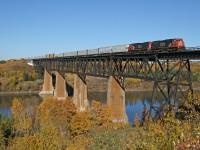 The fall colours have just about peaked in the Edmonton River Valley, as CN 5708 and CN 5746 depart Edmonton with M 31251 01 