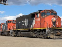 The point man is bringing the units and a cut of cars across 17th street and then onto the Camrose Sub. They are being pulled out of the CN-CP exchange yard located by the Suncor refinery. The crew will make a few more stops going south before running around their train and head north and back to Clover Bar. Sporty blue bell on the 1438.