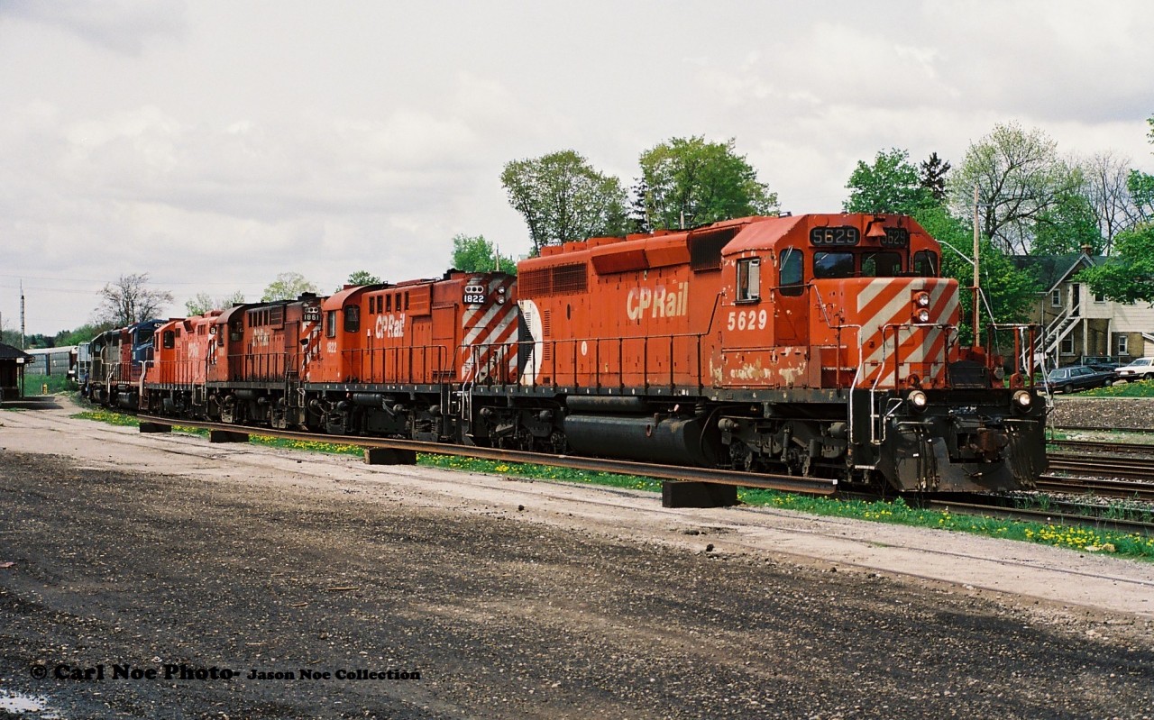 CP 924 is ready to continue its trip eastbound from Galt after setting off cars in the once busy yard. The consist included; 5629, 1822, 1861, 8241, HLCX 4290 and HLCX 4406. This train had attracted quite a bit of attention at the time as both RS18u's 1822 and 1861 were operating their last miles on CP and would eventually be retired later that summer. However, both units would find a second home after retirement. 

1861 would eventually be acquired by the Ontario Southland Railway later that year and became OSRX 181. While also in September 1998, unit 1822 would be sold to the Cuyahoga Valley Scenic Railway to be used on their tourist train operation in Ohio.