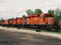 CP 924 is ready to continue its trip eastbound from Galt after setting off cars in the once busy yard. The consist included; 5629, 1822, 1861, 8241, HLCX 4290 and HLCX 4406. This train had attracted quite a bit of attention at the time as both RS18u's 1822 and 1861 were operating their last miles on CP and would eventually be retired later that summer. However, both units would find a second home after retirement. 
<br>
1861 would eventually be acquired by the Ontario Southland Railway later that year and became OSRX 181. While also in September 1998, unit 1822 would be sold to the Cuyahoga Valley Scenic Railway to be used on their tourist train operation in Ohio. 
