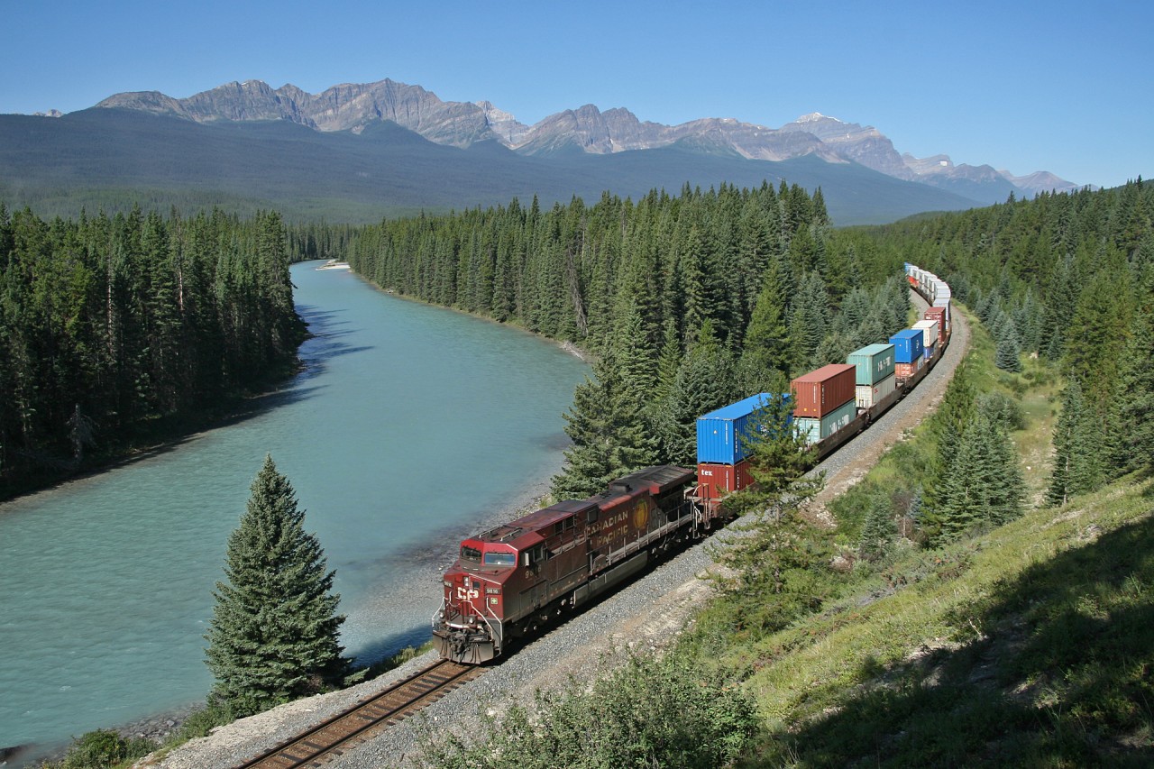 CP 113 rolls past the Storm Mountain Lookout and the crystal clear Bow River
