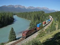 CP 113 rolls past the Storm Mountain Lookout and the crystal clear Bow River