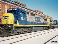 By early 1994, the Railway Capital of Canada was a far cry from its former glory days, however compared to today St. Thomas was still actually an active city as far as being served by different railroads. Long gone were the days of Conrail, Chessie and any passenger trains, however CSX, NS, CN and CP trains still converged on the city. CSX was still operating across the CASO Subdivision, however not for much longer, while NS still ran dedicated auto parts trains on the Cayuga and Paynes Subdivisions, although that window was shortly closing too. In nearby Talbotville, CN served the huge Ford assembly plant and had a large yard with several assignments based, including serving industries on the Cayuga Subdivision. Also, CP came into the city regularly on their St. Thomas Subdivision.
<br>
Here on an incredibly cold but sunny winter afternoon, CSX 7572 and 7756 are viewed idling beside the historic Canada Southern Railway station. This power was likely off CSX R320, which would tie-down here and not continue to Buffalo. Eventually it would become R321 simply departing St Thomas then it would ‘cab hop’ to Fargo, where it would lift all the traffic off the North end and continue to Windsor and Detroit.
